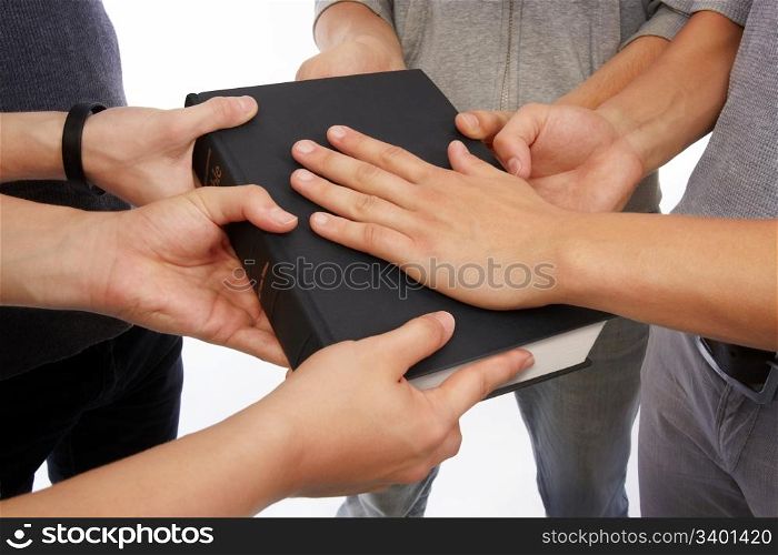 Group of people holding Holy Bible to unity, promises and prayer