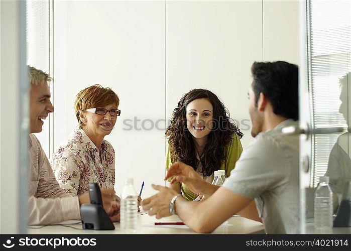 Group of people in a positive meeting