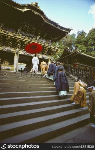 Group of people in a religious procession at a shrine, Yomeimon Gate, Toshu-Gu Shrine, Nikko, Tochigi prefecture, Japan