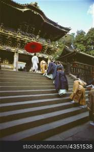Group of people in a religious procession at a shrine, Yomeimon Gate, Toshu-Gu Shrine, Nikko, Tochigi prefecture, Japan