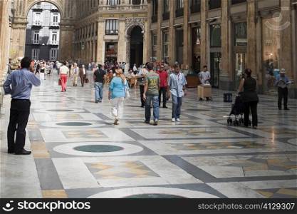 Group of people in a shopping mall, Galleria Umberto I, Naples, Naples Province, Campania, Italy