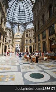 Group of people in a shopping mall, Galleria Umberto I, Naples, Naples Province, Campania, Italy