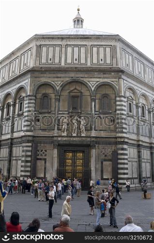 Group of people in front of a church, Battistero di San Giovanni, Florence, Italy