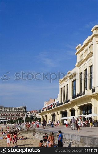 Group of people in front of a hotel, Casino Municipal, Hotel Du Palais, Grande Plage, Biarritz, France