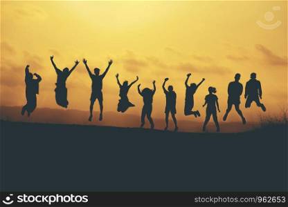 group of people jumping over the mountain sunset, friends party, happy time