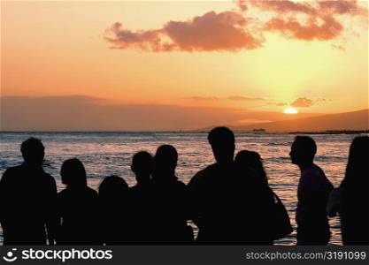 Group of people looking at a view on the beach, Waikiki Beach, Honolulu, Oahu, Hawaii Islands, USA