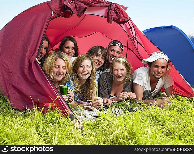 Group of people lying in tent