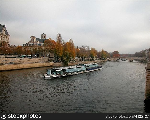Group of people on a ferry in a river, Seine River, Paris, France