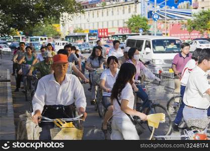 Group of people riding bicycles, HohHot, Inner Mongolia, China