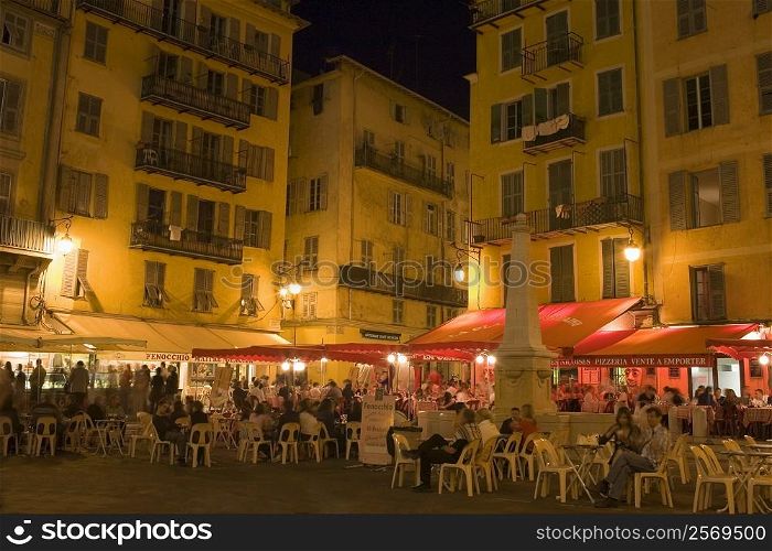 Group of people sitting at a sidewalk cafe, Nice, France