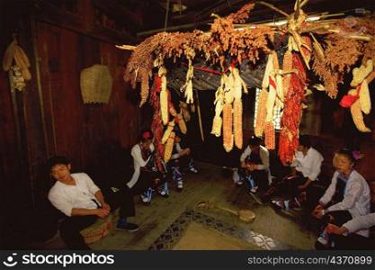 Group of people sitting in a house, Yangshuo, Guangxi Province, China