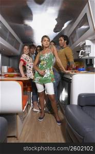 Group of people standing in a motor home