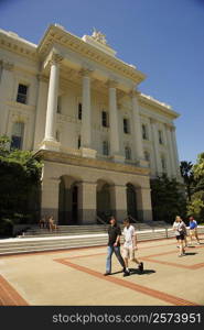 Group of people walking in front of a building, California, USA