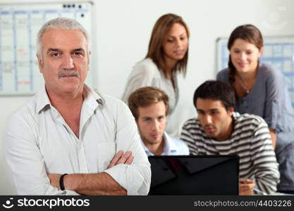 group of persons on a computer