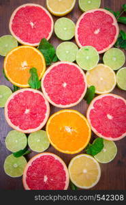 group of pink grapefruits, lime, orange and lemons