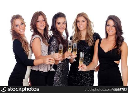 Group of pretty friends toasting with champagne in a celebration during christmas