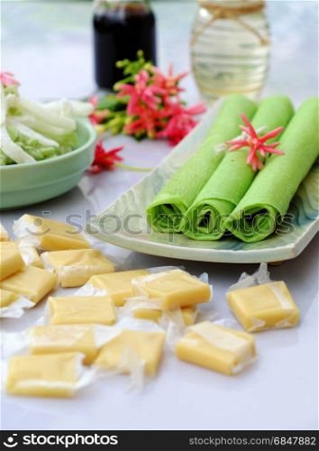 Group of product from coconut with candy, milk rice paper, coconut oil, dark soy sauce, jam or coconut water, are popular Vietnam food, group of snacks and drink on white background