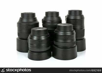 Group of professional and modern lenses for DSLR camera isolated on a white background in close-up