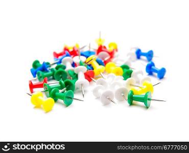 Group of pushpins. Shallow DOF. Isolated over white.