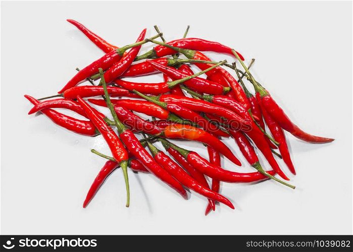 Group of red chilli pepper on white board,food background