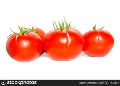 Group of red fresh tomatoes isolated on white background