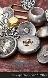 group of retro iron buttons. Large set of stylish old-fashioned metal buttons for clothes