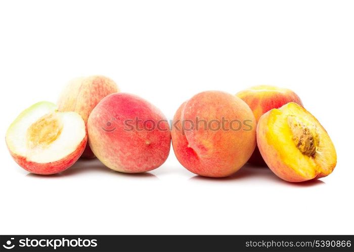 Group of ripe pink and yellow peaches