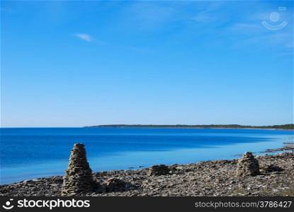 Group of rock piles at a clear blue sky by the coast of the swedish island Oland