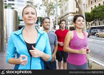 Group Of Runners On Urban Street