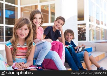 Group of school kids sitting on stairs