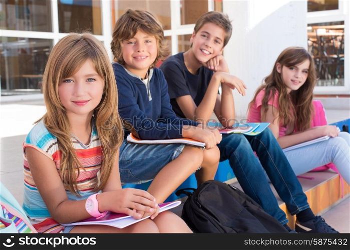 Group of school kids sitting on stairs