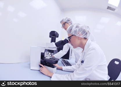 group of scientists working at the laboratory