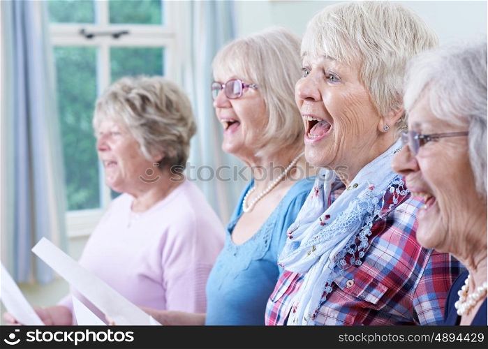 Group Of Senior Women Singing In Choir Together