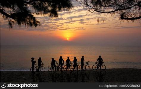 group of silhouette biker park on beach looking sun set or sun rise and  abstract beauty sky nature background