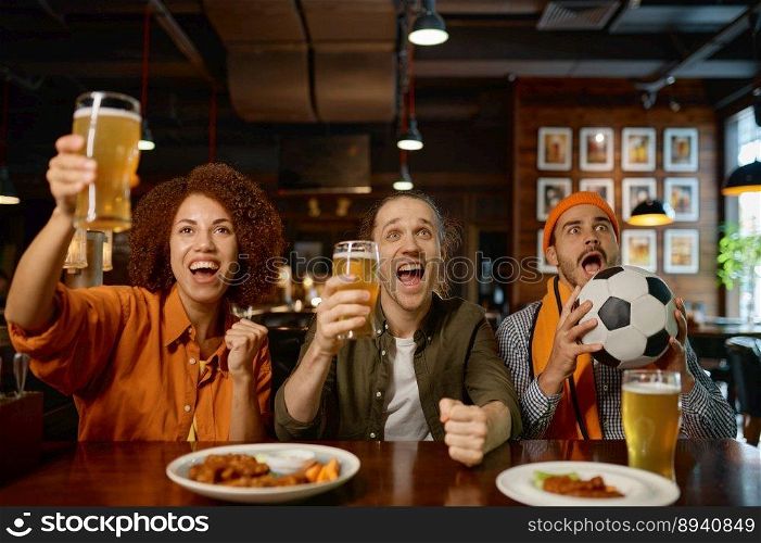 Group of sports fan celebrating goal for favorite soccer team. Young diverse multiracial cheering people drinking craft beer while watching football match at sports bar. Group of sports fan celebrating goal for team and cheering at sports bar