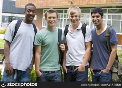 Group of students outdoors looking at camera smiling