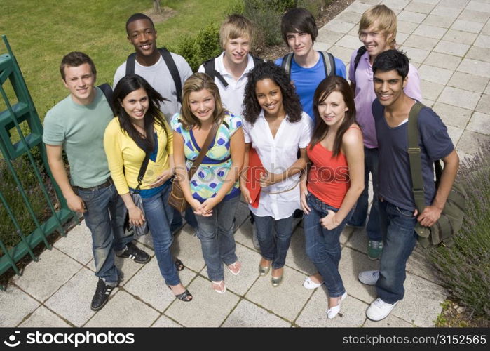 Group of students outdoors looking at camera smiling