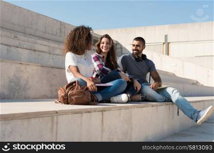 Group of students sitting on school stairs