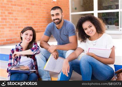 Group of students sitting on school stairs