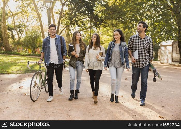 Group of students walking together in the park