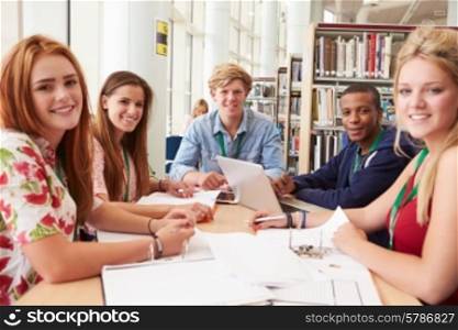 Group Of Students Working Together In Library