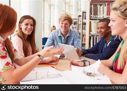 Group Of Students Working Together In Library