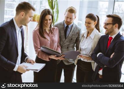 Group of successful business people standing in the office