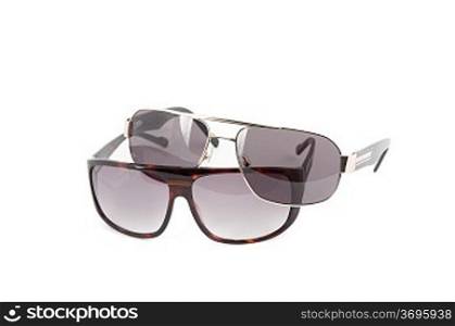 Group of sunglasses on white background