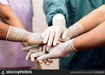 Group of Surgeon medical team coordinate handshaking.Team of doctors and nurses work together to fight against diseases and viruses.