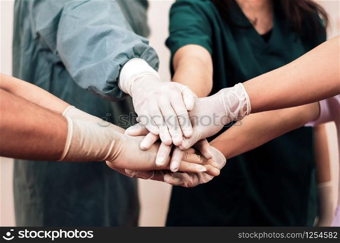 Group of Surgeon medical team coordinate handshaking.Team of doctors and nurses work together to fight against diseases and viruses.