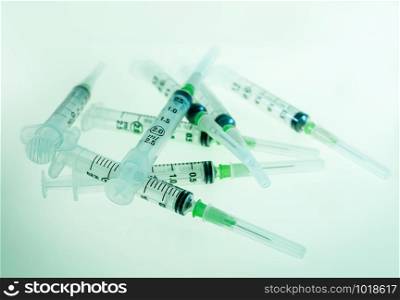 Group of syringes on blue background. Syringes on blue background