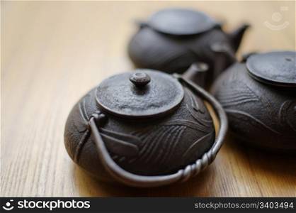 Group of teapots on a table