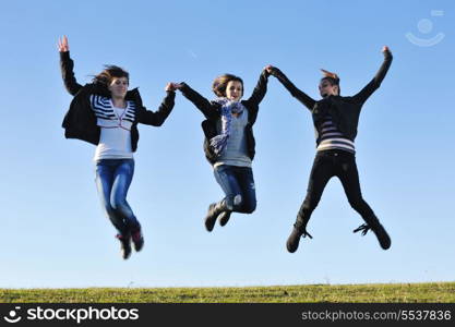 group of teen people woman have fun outdoor with blue sky in background