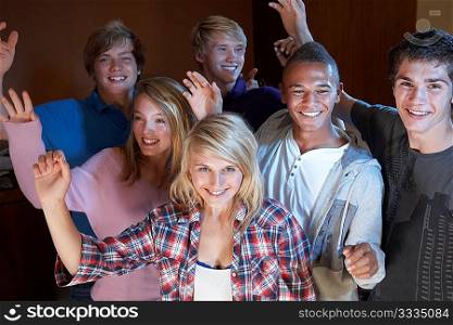 Group Of Teenage Friends Dancing And Drinking Alcohol